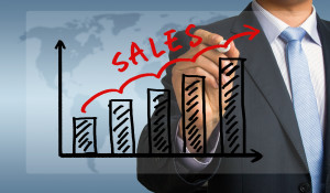 sales graph hand drawing by businessman